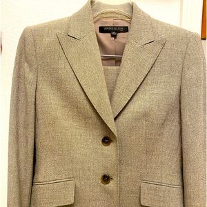 Suit with rich tan hues and specks of brown. Jacket w/skirt, size 4P.